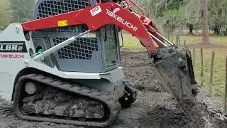 Takeuchi TL8R2 compact track loader grading