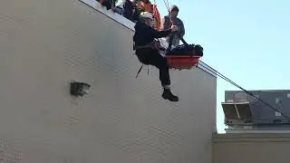 Man rescued after suffering medical emergency while on roof of building in Newark, Delaware.