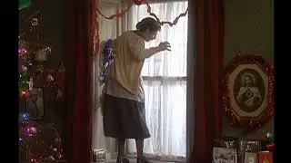 Mrs Doyle decorates a window