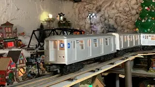 Mth E train over the city