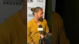 Jason Momoa distracted by son Wolfie mid interview