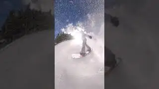 Snowboard spray, almost covered the camera with snow.