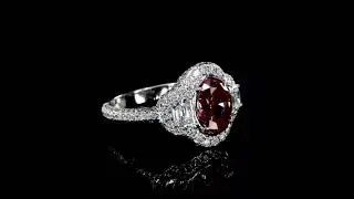 Three-stone ring features a stunning oval-cut ruby, flanked by two elegant half-moon🌙 side diamonds.