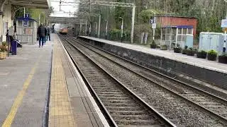 DB Cargo 67015 hauls a TFW mark 4 set through Alderly edge on 1V37