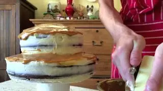 Two Tiered Chocolate & Caramel Cake with a cherry on top