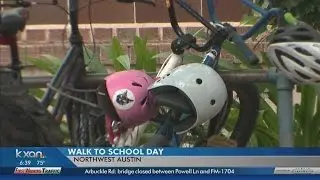 Student hiking or biking to school for Walk to School Day