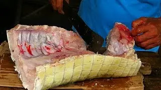 Chopping Crocodile Meat, Alligators and Caimans at Belen Street Market in Iquitos, Peru