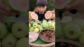 Eating guava with spicy sauce