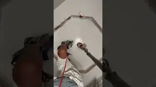 Spraying Behr premium plus Ceiling paint on 20 foot ceiling octagon .