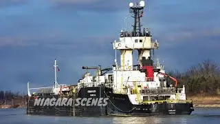 Tugboat EVERLAST and Barge NORMAN MCLEOD pass Port Robinson on the Welland Canal