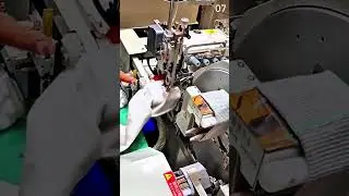 Automated machine stitching white fabric in textile production