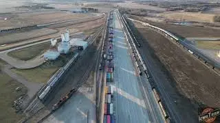 Iowa Northern Butler yard and Trinity Rail drone view. BNSF grain train with DPU!