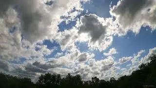 Drifting Cumulus Clouds on a Sunny Day