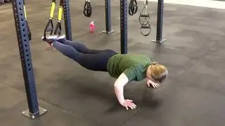 Courtni demonstrates an atomic pushup at Buffalo Personal Training & Fit Body Bootcamp