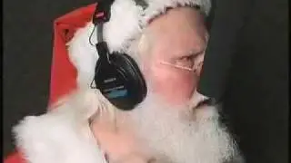 Santa behind the mic by Dailey and Associates