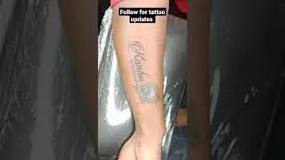Krishna Tattoo with flute and Peacock feather.