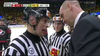 the ref and Canada head coach Alan Letang