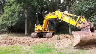JCB JS130 filling in root holes