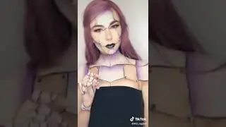 Purple robot lady. Robot makeup robot movement body art