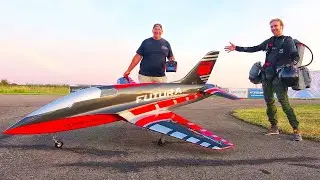 JET SUIT MAN SAM ROGERS FLYING TOGETHER WITH HUGE RC JET