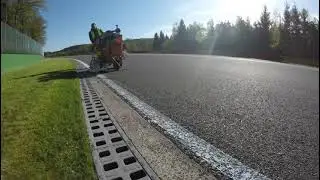 Line Painting the motorsport circuit at Spa, Belgium