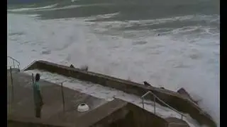Dangerous: Biarritz high tide big waves - guy in sea