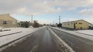 Going through wintery Tapanui on the DR 650