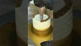 Smooth ombr&eacute; buttercream, finished with chocolate piping and subtle accents