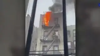 Video: Firefighters rescue man trapped in NYC fire