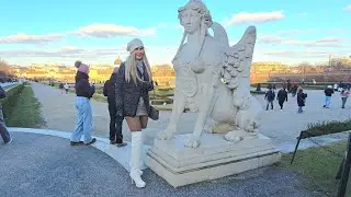 4kGranate Travelling walking in public, Belvedere garden, Vienna, minidress, white thigh high boots