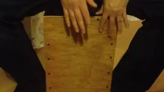 Cajon drumming with 16th note style rhythm with triplets