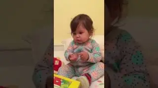 Madison mistakes a book for Ipad