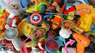 Discover vintage items | Found old superhero toys, miniature toy airplanes & bikes, and mini fans.