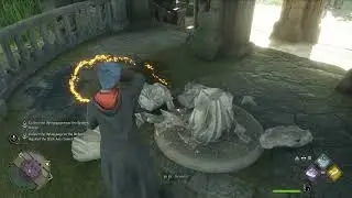 Collect the flying page near the broken statue Hogwarts Legacy