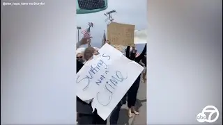 Crowds protest beach closure due to coronavirus in Southern California