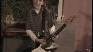 Paul Morrison is 10 &  plays rock guitar Jan 6 2002 OKSS Party