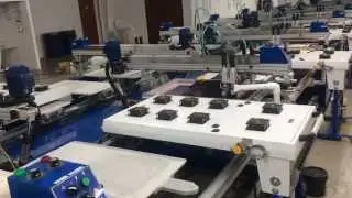 Askme Printing Machine, 54 stations, 16 pressers, 2 units of flocking. @ Hong Ho Mexico S.A. de C.V.
