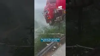 Truck hangs over collapsed bridge in China