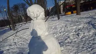 Snow man taking a sun bath