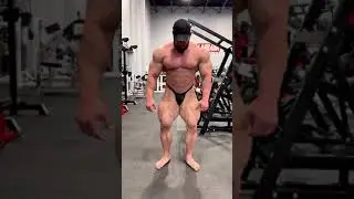 Muscle bull Hunter Labrada flexing in black posing trunks