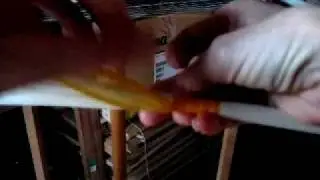 Tying a ikat knot on a warp for dyeing