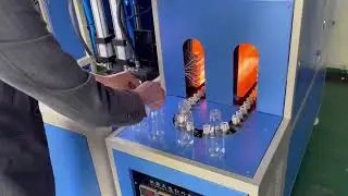 How does a semi-automatic blow molding machine work?