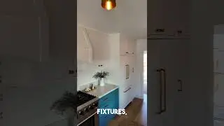 Stunning Custom Kitchen with Brass Accents and Unique Lighting