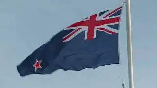 the national flag of new zealand waving on a white pole  HD