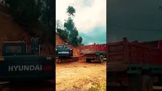 Excavator Loading Dump Trucks, Clearing Landslide