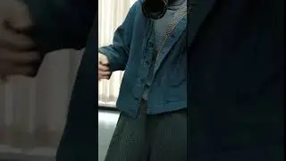 vintage teal hooded workwear jacket with houndstooth lining over charcoal turtleneck