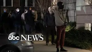 Georgians line up to vote in Senate runoff election
