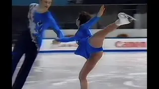 Beautiful russian skater dances on ice with her partner. Beautiful short skirt features her lines