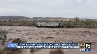 33 people rescued after tour bus is swept down flooded wash in N. Arizona