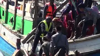 Rohingya migrants detained at sea arrive at Myanmar camp